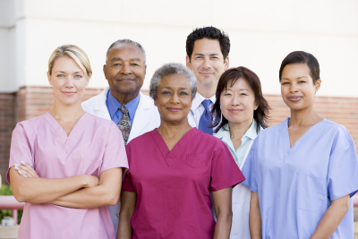 hospital staff standing outside of a hospital